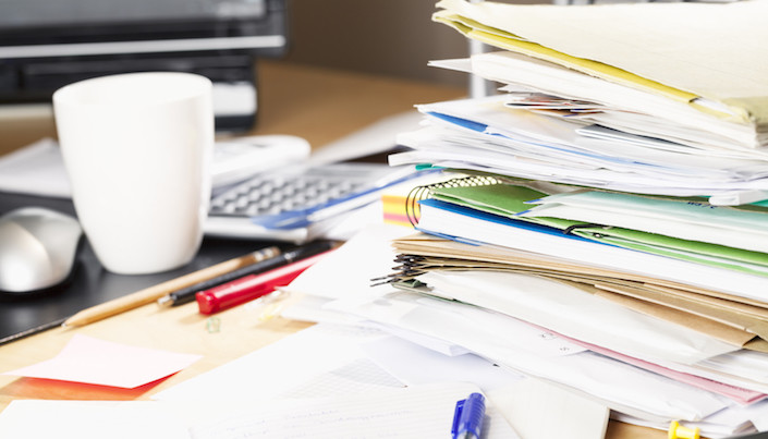 messy desk paperwork